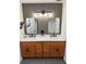 Modern bathroom with dual sinks, updated lighting and vanity at 4531 Kings Lake Dr, Marietta, GA 30067