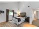 Bedroom with a dramatic ceiling, modern lighting, and hardwood floors at 4531 Kings Lake Dr, Marietta, GA 30067