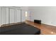 The staged bedroom has wood-look flooring, double closets, and neutral walls at 4531 Kings Lake Dr, Marietta, GA 30067