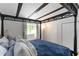 Primary bedroom with decorative bedframe, side table and light-blocking curtains at 4531 Kings Lake Dr, Marietta, GA 30067