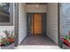 Charming entryway featuring a striking wooden door and decorative plants at 4531 Kings Lake Dr, Marietta, GA 30067