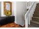 Entryway featuring tile flooring, a stylish console table, and modern decor and a carpeted staircase at 4531 Kings Lake Dr, Marietta, GA 30067