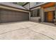 Modern home exterior showcasing a two-car garage, stylish front door, and well-manicured landscaping, enhancing curb appeal at 4531 Kings Lake Dr, Marietta, GA 30067