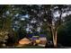 Twilight view of a house showing the mature surrounding trees and landscape at 4531 Kings Lake Dr, Marietta, GA 30067
