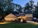Exterior shot of a house with well-maintained lawn, a side-entry garage, and a cozy front porch at 4531 Kings Lake Dr, Marietta, GA 30067