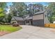 Beautiful house with a spacious driveway and a well-kept lawn at 4531 Kings Lake Dr, Marietta, GA 30067