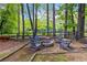 Inviting fire pit area with Adirondack chairs, creating a cozy outdoor gathering space at 4531 Kings Lake Dr, Marietta, GA 30067