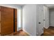 Inviting foyer showcasing a modern wooden door, terracotta-style tile and white walls at 4531 Kings Lake Dr, Marietta, GA 30067