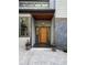 Stylish front entrance with a modern wood door, gray accents, and decorative planters at 4531 Kings Lake Dr, Marietta, GA 30067