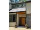 Stylish front entrance with a contemporary door, modern accents, and natural light at 4531 Kings Lake Dr, Marietta, GA 30067
