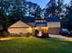 Charming two-story home with a well-maintained lawn and manicured landscaping at 4531 Kings Lake Dr, Marietta, GA 30067