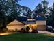 Charming two-story home with a well-maintained lawn and manicured landscaping at 4531 Kings Lake Dr, Marietta, GA 30067
