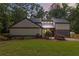 Charming home with manicured lawn, mature trees, and stone accents at 4531 Kings Lake Dr, Marietta, GA 30067