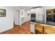Open kitchen area with an island, laundry, stainless appliances, and white cabinetry at 4531 Kings Lake Dr, Marietta, GA 30067