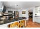 Modern kitchen with granite countertops, stainless steel appliances, and breakfast bar seating at 4531 Kings Lake Dr, Marietta, GA 30067