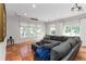 Spacious living room with large sectional, terracotta tile floors, and projector setup, perfect for movie nights at 4531 Kings Lake Dr, Marietta, GA 30067