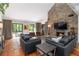 Spacious living room features a stone fireplace, terra cotta tile flooring and abundant natural light at 4531 Kings Lake Dr, Marietta, GA 30067