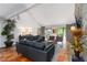 Spacious living room with terra cotta flooring, stone fireplace, and large windows at 4531 Kings Lake Dr, Marietta, GA 30067