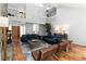 Open living room with high ceilings, a loft, modern furniture, and terra-cotta tile flooring at 4531 Kings Lake Dr, Marietta, GA 30067