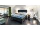 Well-lit main bedroom with dark floors, balcony access, and simple decor at 4531 Kings Lake Dr, Marietta, GA 30067
