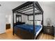 The main bedroom includes a four-poster bed, wood floors, and an en-suite bath at 4531 Kings Lake Dr, Marietta, GA 30067