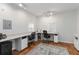 Bright home office with large desks, neutral paint, and two windows with natural light at 4531 Kings Lake Dr, Marietta, GA 30067