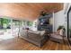 Relaxing porch features wood flooring, a fireplace, a TV, and plush seating for outdoor living at 4531 Kings Lake Dr, Marietta, GA 30067