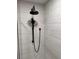 Modern shower featuring a sleek, all-black rainfall shower head and handheld sprayer at 4531 Kings Lake Dr, Marietta, GA 30067