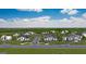 Sprawling aerial image showing multiple luxury houses surrounded by greenery in a high-end community at 7504 Rivertown Rd, Fairburn, GA 30213