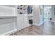 Organized walk-in closet with built-in shelving and drawers at 7504 Rivertown Rd, Fairburn, GA 30213