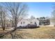 Home exterior featuring a wooden deck and backyard lawn at 7760 Poppy Dr, Winston, GA 30187