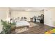 Spacious basement area furnished with a comfortable bed and rugs, creating a cozy and inviting living space at 7760 Poppy Dr, Winston, GA 30187