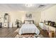 Finished basement offers flexible space, with hardwood floors, bed, and seating area at 7760 Poppy Dr, Winston, GA 30187