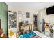 Comfortable bedroom features a desk, bookshelf, and plenty of space for toys with hardwood style flooring at 7760 Poppy Dr, Winston, GA 30187