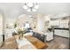 Open-concept dining area and kitchen with modern lighting and decor, with view into Living Room at 7760 Poppy Dr, Winston, GA 30187
