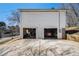 Spacious two-car garage featuring two bays and a single entry door at 7760 Poppy Dr, Winston, GA 30187