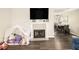 Modern living room with decor fireplace and dining room space at 7760 Poppy Dr, Winston, GA 30187