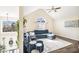 Spacious living room featuring vaulted ceilings, a large window, and a sectional couch at 7760 Poppy Dr, Winston, GA 30187