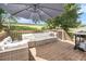 Outdoor patio with comfortable seating and a grill, perfect for relaxing and entertaining in the backyard at 7760 Poppy Dr, Winston, GA 30187