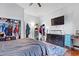 Bedroom with hardwood floors, closet and modern entertainment setup at 1081 Longley Nw Ave, Atlanta, GA 30318