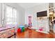 Cozy bedroom with charming details, including a decorative fireplace and playful decor at 1081 Longley Nw Ave, Atlanta, GA 30318