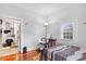 Bedroom featuring hardwood floors, a window providing natural light, and basic furnishings at 1081 Longley Nw Ave, Atlanta, GA 30318
