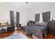 Bedroom with hardwood floors, desk area, and comfortable sleeping space at 1081 Longley Nw Ave, Atlanta, GA 30318