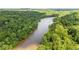 Beautiful aerial shot of a wide river flowing through dense green forest and trees at 1250 Parkwood Se Cir # 1203, Atlanta, GA 30339