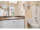 Bathroom featuring granite countertops, a large mirror, and great lighting at 1250 Parkwood Se Cir # 1203, Atlanta, GA 30339