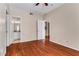 This bedroom features a ceiling fan and gorgeous hardwood flooring at 1250 Parkwood Se Cir # 1203, Atlanta, GA 30339