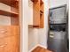 Closet featuring custom shelving and a convenient stacked washer and dryer at 1250 Parkwood Se Cir # 1203, Atlanta, GA 30339