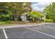 Exterior shot of the clubhouse entrance with parking available and well-landscaped green space at 1250 Parkwood Se Cir # 1203, Atlanta, GA 30339