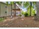Outdoor community space featuring a pergola, seating, mature trees, and well-maintained grounds at 1250 Parkwood Se Cir # 1203, Atlanta, GA 30339