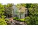 Exterior of a well-maintained building with large windows, surrounded by green trees and landscaping at 1250 Parkwood Se Cir # 1203, Atlanta, GA 30339
